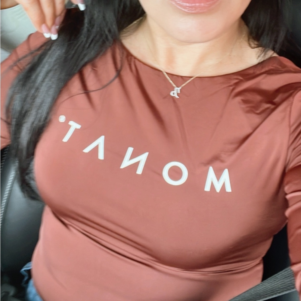 Gorgeous copper bronze color bodysuit from MONAT